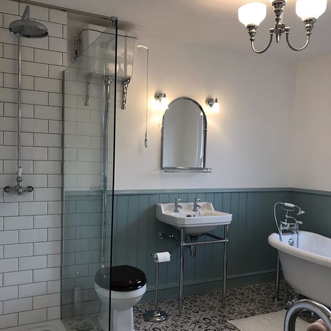 Traditional bathroom with glass shower screen and subway tiles
